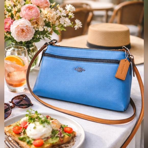 Coach Handbags - 💙 Coach Pebbled Leather Crossbody Clutch – Blue with Saddle Trim